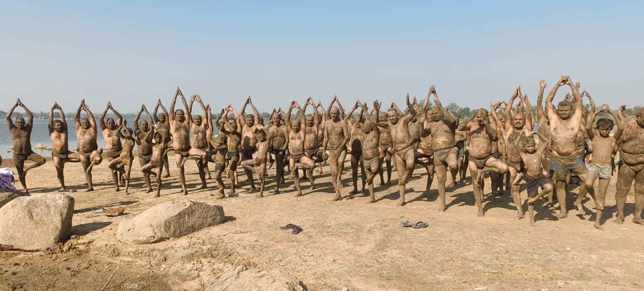 Mud baths in Jangampally pond