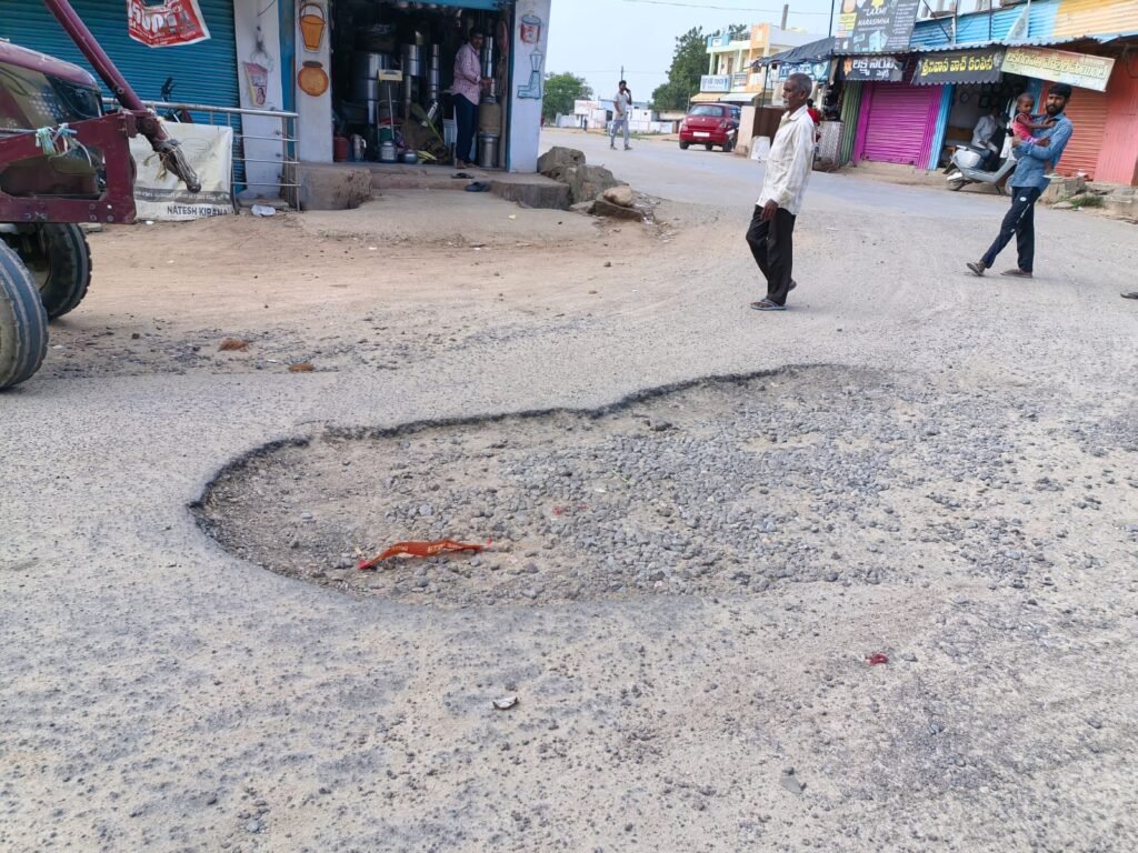 Nandipet Gram Panchayat filled the potholes on the road.