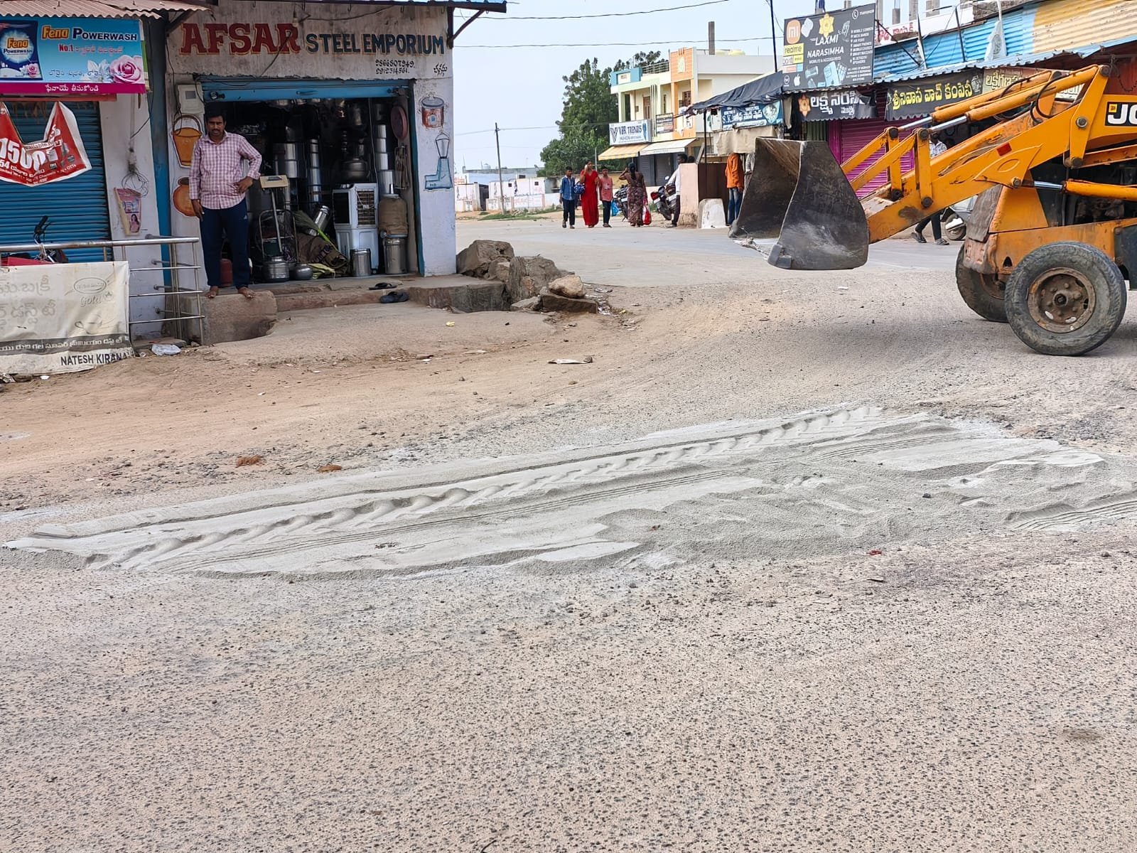 Nandipet Gram Panchayat filled the potholes on the road.
