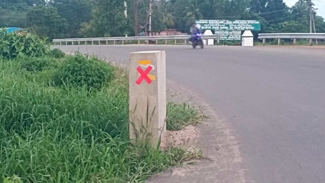 Where are the signboards on the road?