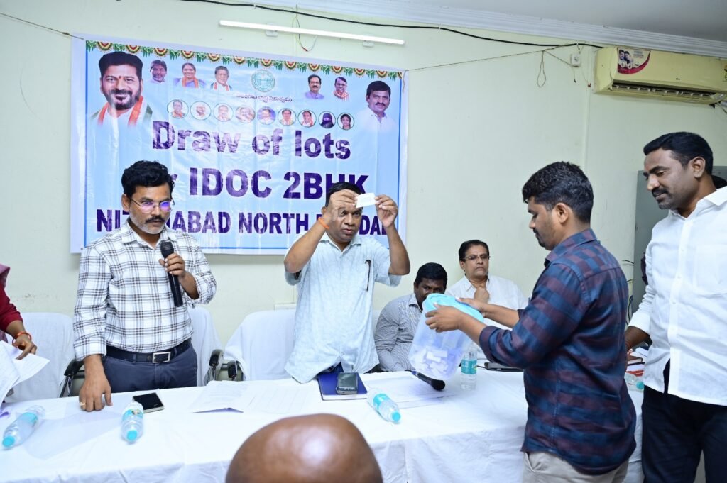 Selection of beneficiaries for the allotment of double-bedroom houses through a lucky draw.