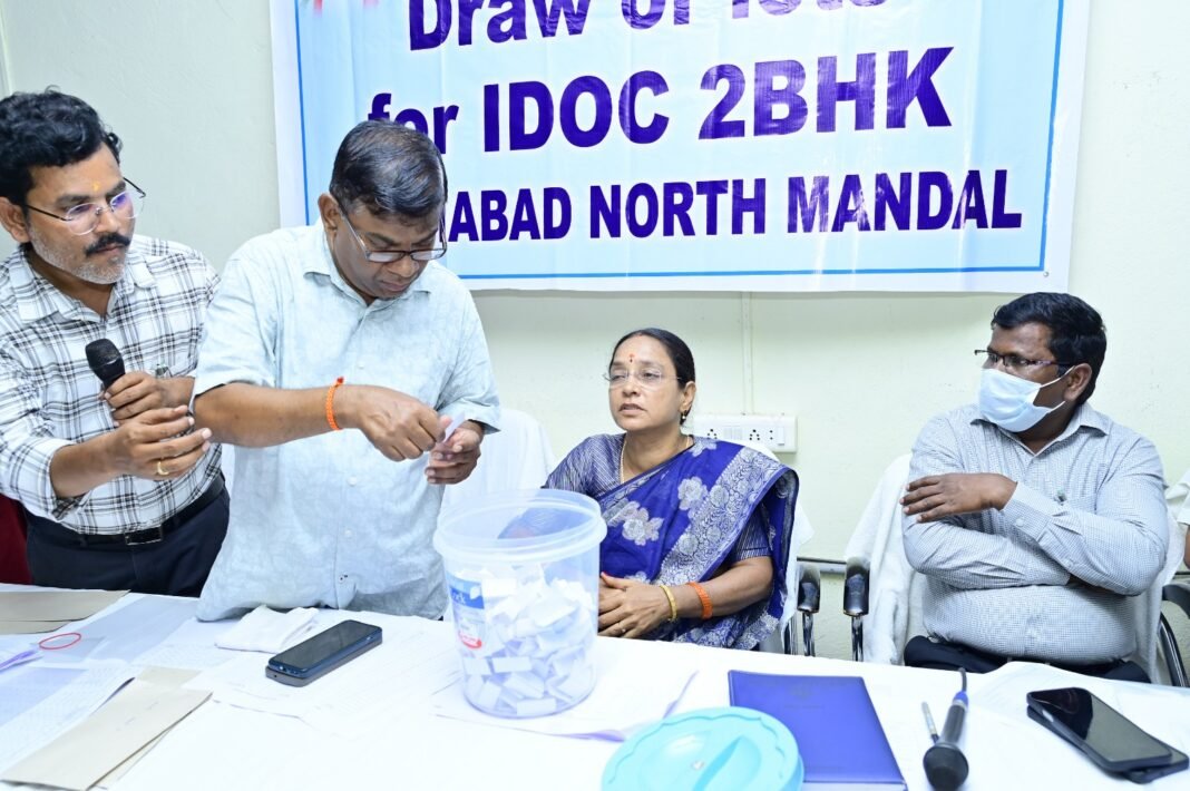 Selection of beneficiaries for the allotment of double-bedroom houses through a lucky draw.