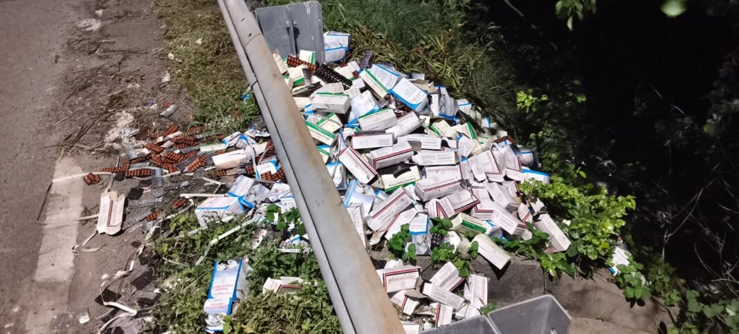 Piles of government medicines by the roadside.